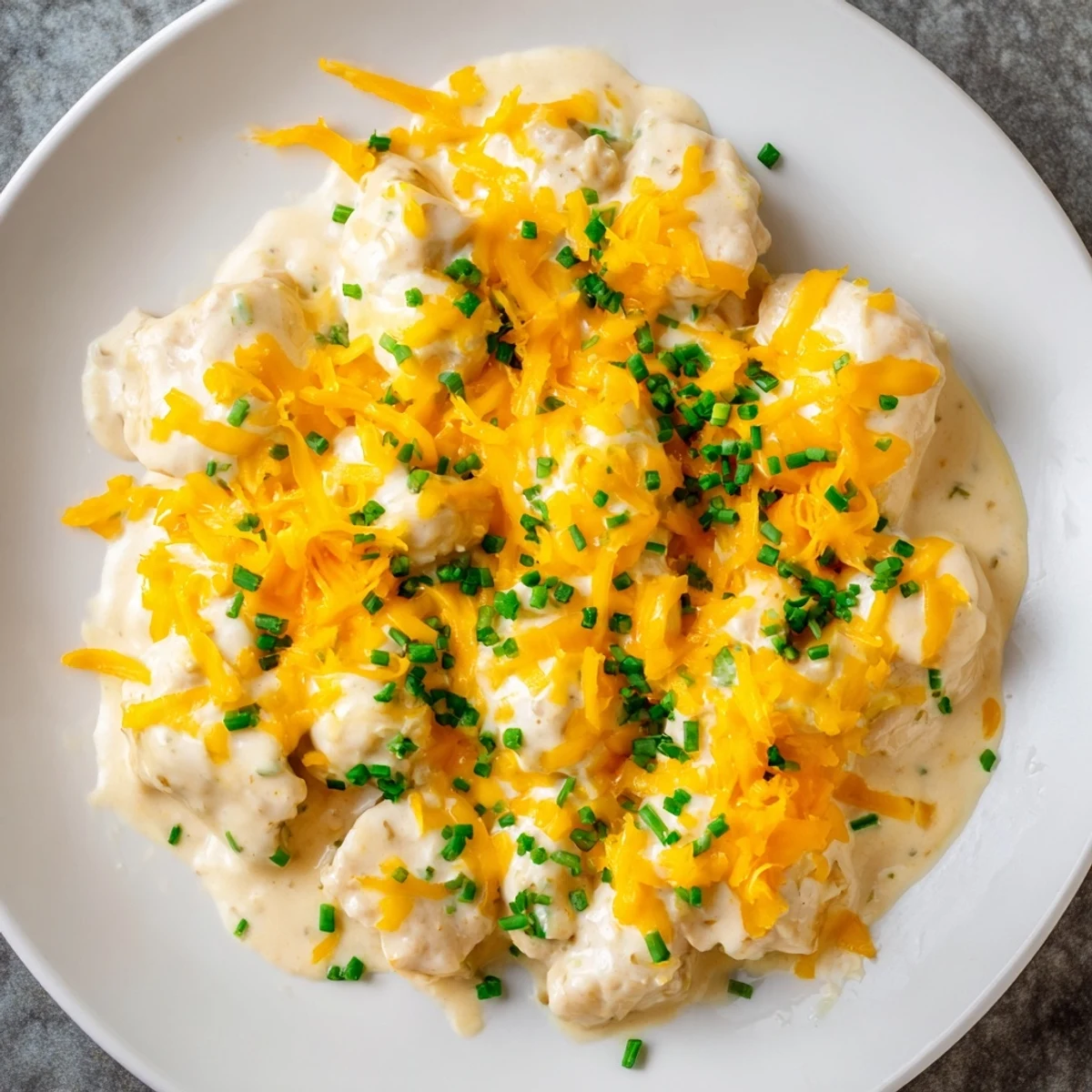 Golden, bubbly Cheddar Ranch Chicken Bake fresh from the oven, a savory, cheesy comfort food.