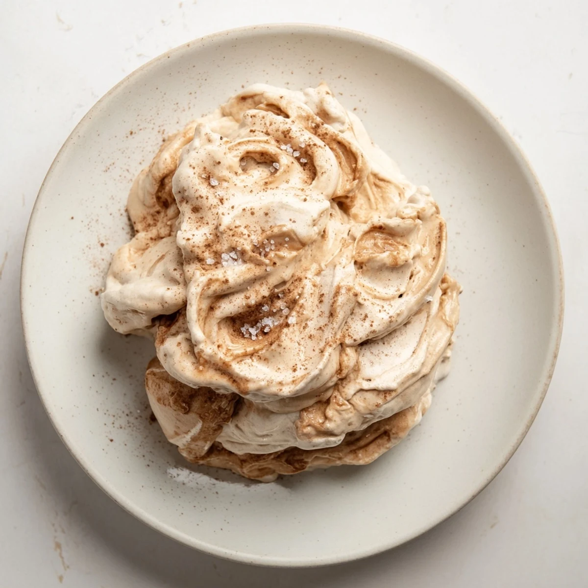 Homemade Peanut Butter Banana Ice Cream in a bowl: a swirl of frozen banana and peanut butter goodness.