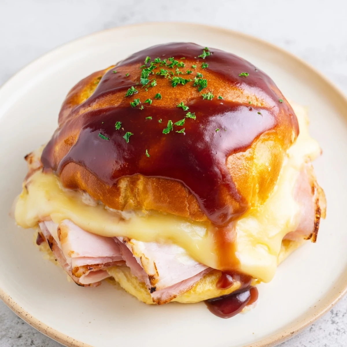 Warm Cherry-Glazed Ham and Cheese Slider mashup, golden-brown and bubbling for a satisfying comfort meal.