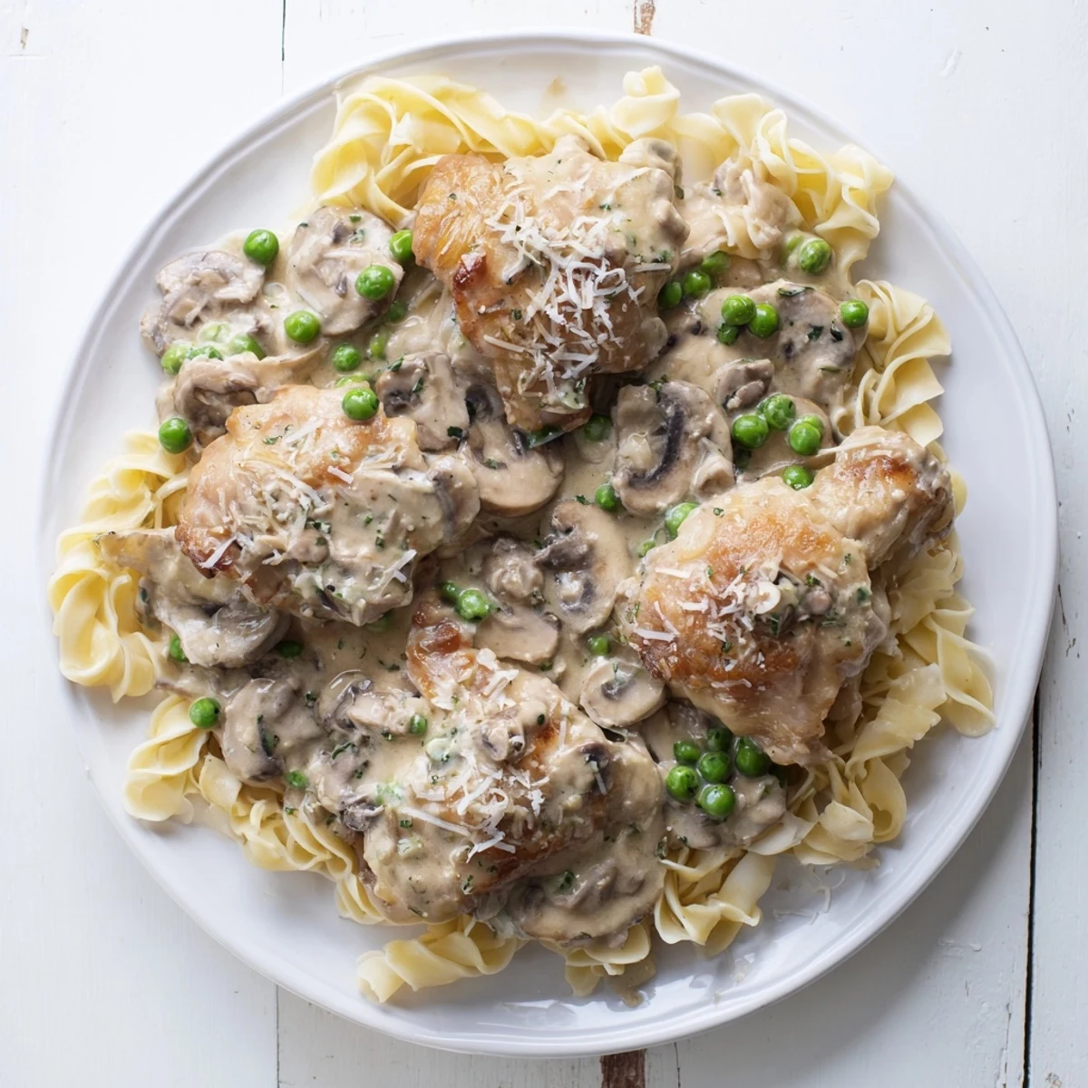 Creamy Chicken Alfredo Slow-Cooker Dump Meal swimming in a rich, velvety Alfredo sauce, perfect for pasta.