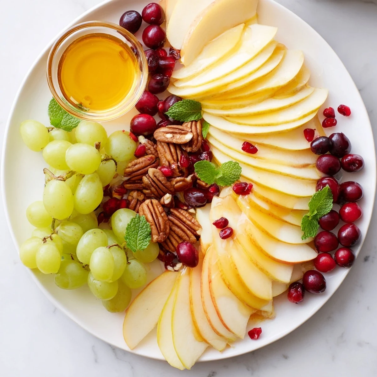 Vibrant Apple Orchard Fruit Board with honey for dipping, a beautiful party appetizer.