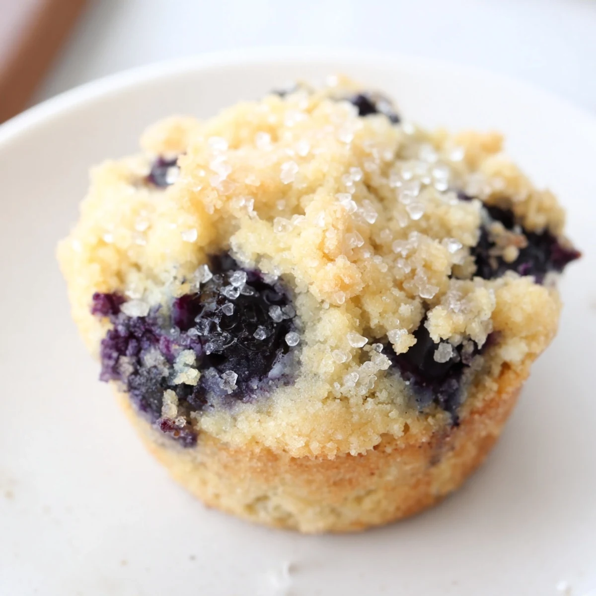 Mini blueberry muffins arranged in a rustic basket, perfect for a delightful Sunday brunch.