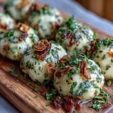 Pillowy German Potato Dumplings served steaming hot, perfect alongside savory meats.
