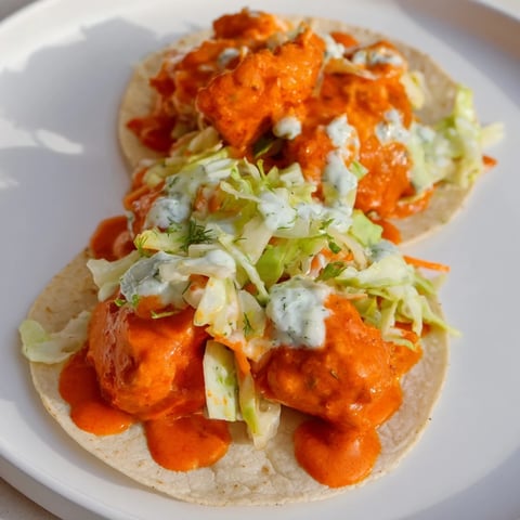 Crispy Buffalo Chicken Smash Burger Tacos with vibrant ranch slaw, perfect for a spicy dinner.