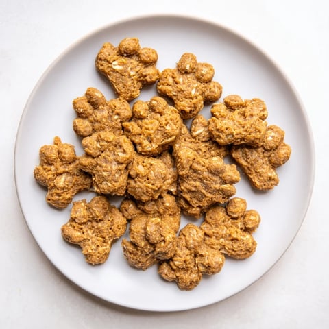 Golden, baked Friendly Dog Paw Treats, a wholesome homemade snack for your playful pup.