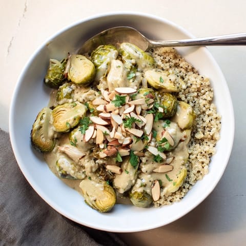 A close-up of Alfredo Roasted Brussels Sprouts: nutty, cheesy, and savory vegetarian comfort food.