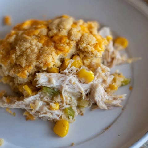 Delicious Southern Cornbread Chicken Casserole with visible chunks of chicken and sweet corn, a family favorite.