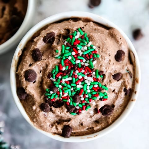 Festive Tree Brownie Dip, creamy and swirled, perfect for the holidays with colorful sprinkles atop.