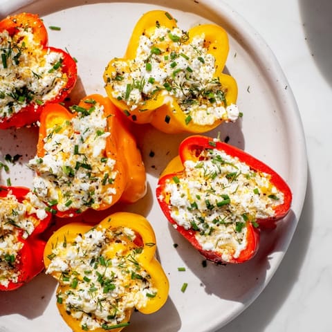 Fresh, colorful image of Mediterranean mini bell pepper halves with a zesty feta cheese filling.