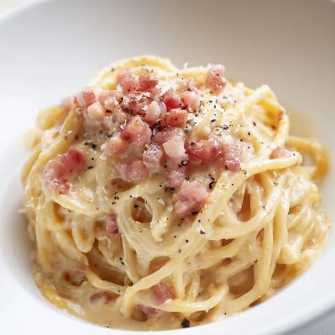 This satisfying Ramen Carbonara Hack features perfectly cooked noodles and a cheesy, decadent sauce.