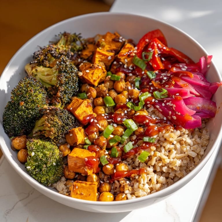 Robust Bold Sauce Drizzle Bowls overflowing with roasted vegetables and chickpeas.