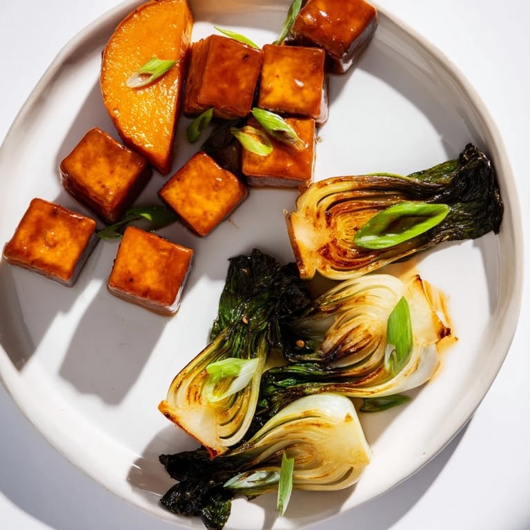 Savory miso glaze coats the roasted tofu and squash, a plant-based delight perfect for dinner.