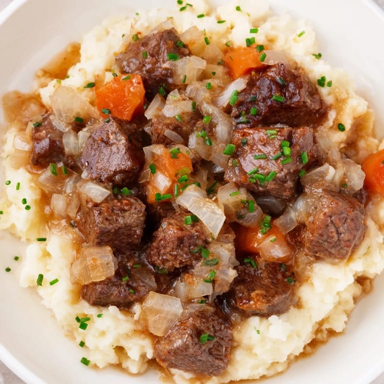 A comforting close-up showcases the rich hues of Fall Apple Cider Stew served in bowls.
