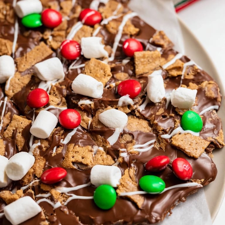Imagine biting into this easy Quick Christmas Smores Bark, a layered treat with holiday sprinkles and rich chocolate.