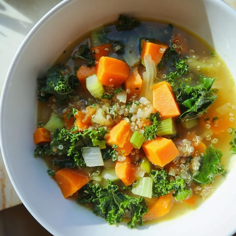 A hearty spoonful of Nourishing Winter Veggie Soup, packed with tender vegetables and quinoa.