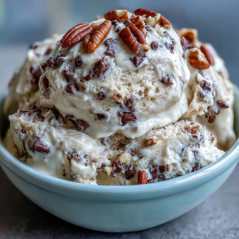 Protein-rich Greek yogurt cookie dough swirled with nut butter and mini chocolate chips, ready to enjoy straight from the bowl.